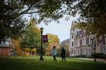 Move to Two students walking on the campus quad slide